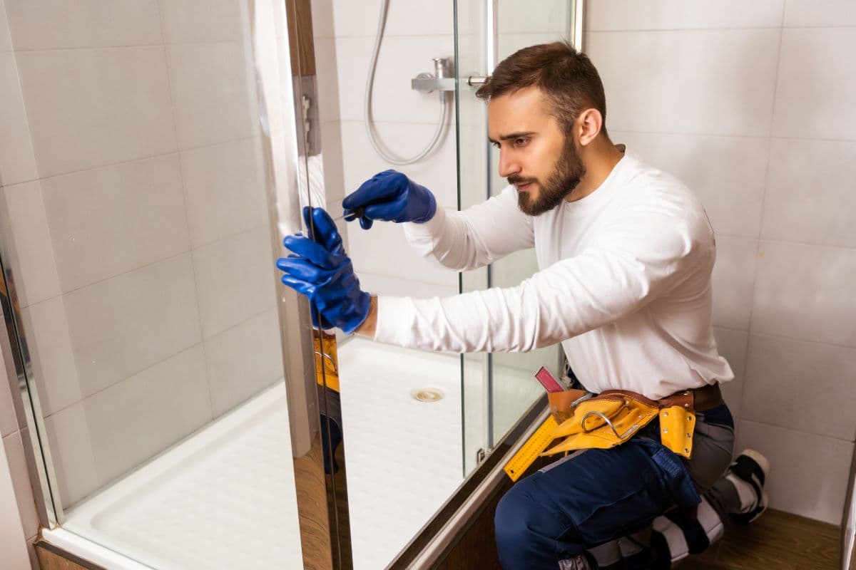 Plumber installing a new bathroom faucet and vanity in Sparks, NV