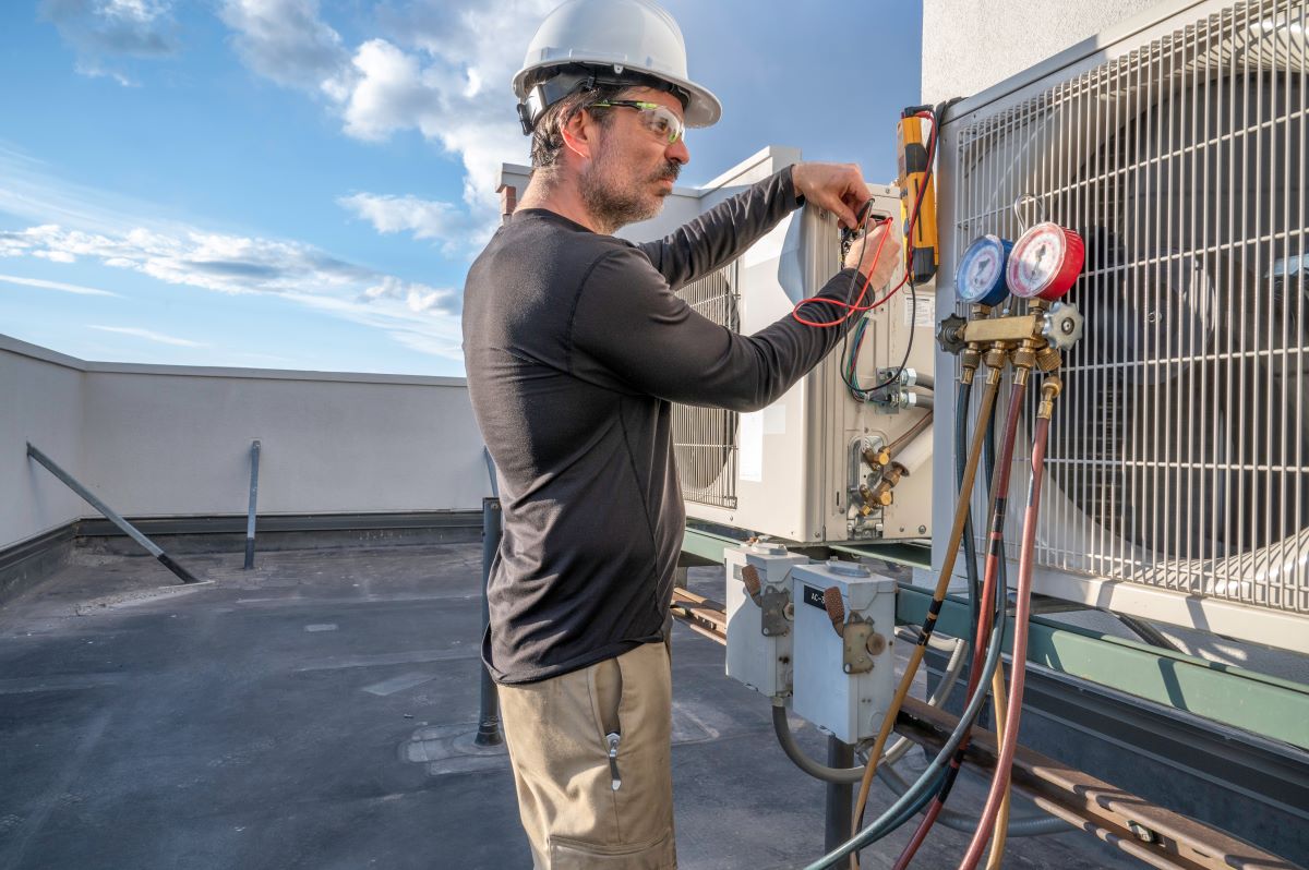 Technician servicing a commercial HVAC system in Sparks, Nevada