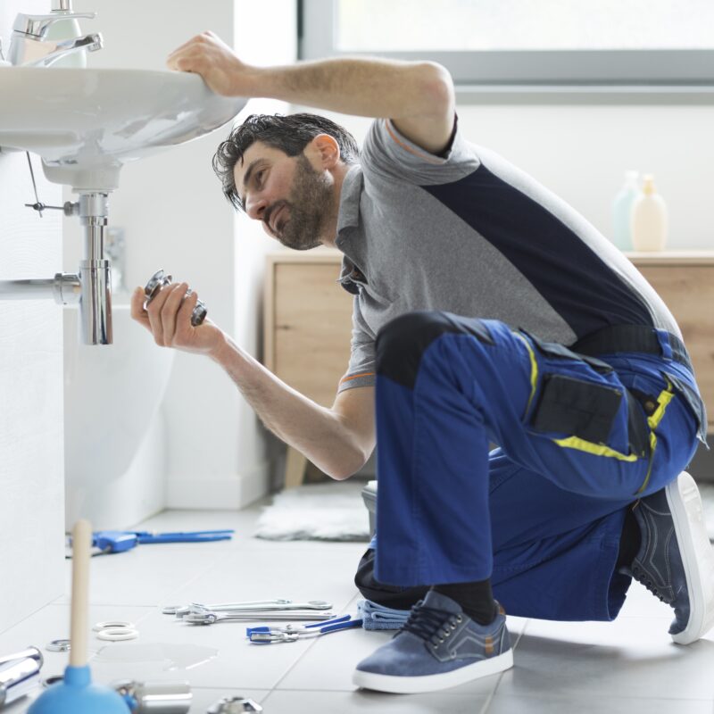 Plumber repairing a faucet in Reno, Nevada