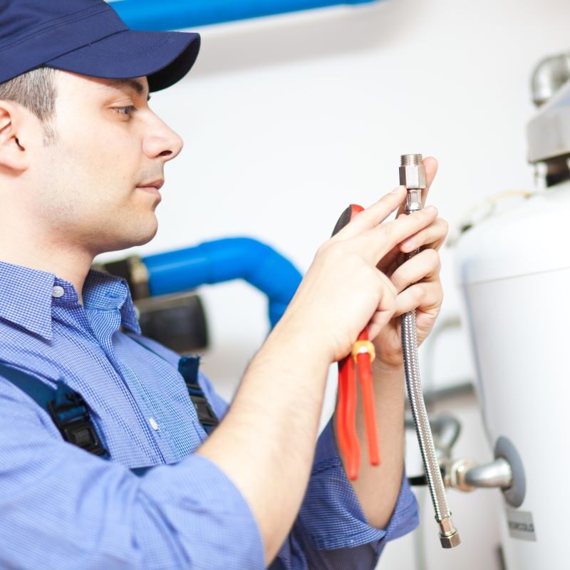 Plumber repairing water heater in Sparks & Reno, Nevada