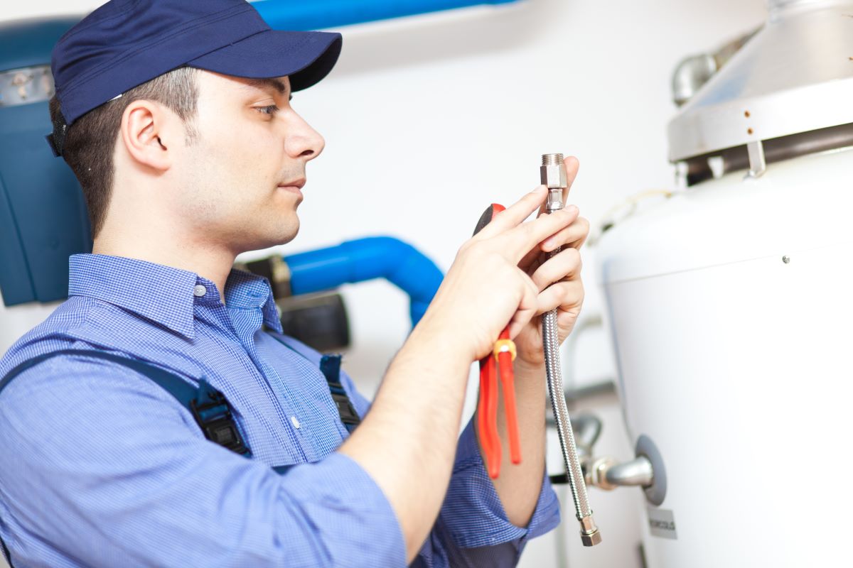 Plumber repairing water heater in Sparks & Reno, Nevada